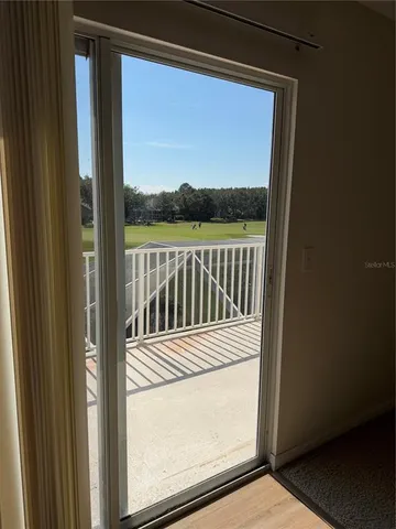 an empty room with a ceiling fan
