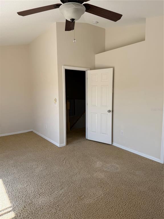 10760 Plantation Bay Drive Tampa, FL 33647 - Photo 24 of 39 an empty room with a ceiling fan