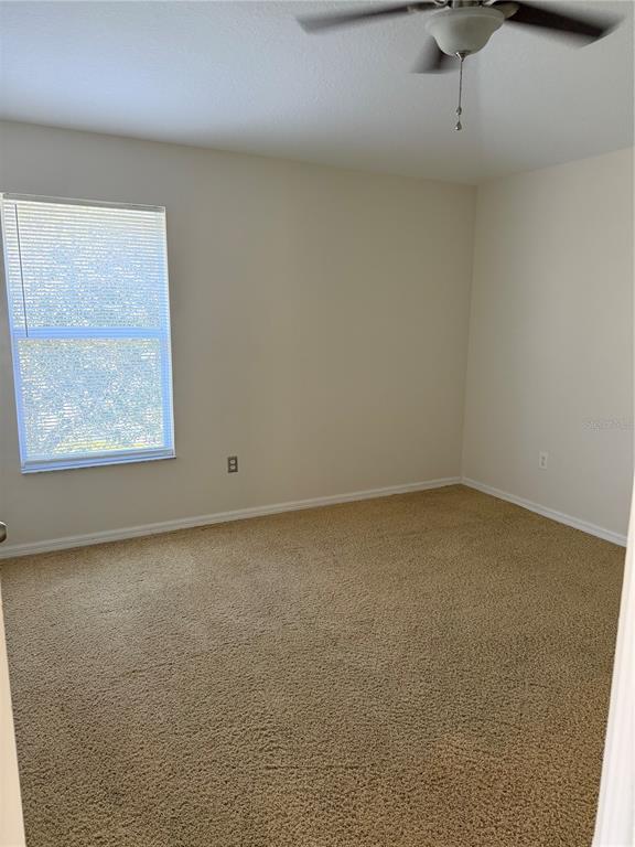 10760 Plantation Bay Drive Tampa, FL 33647 - Photo 30 of 39 a view of an empty room with a window