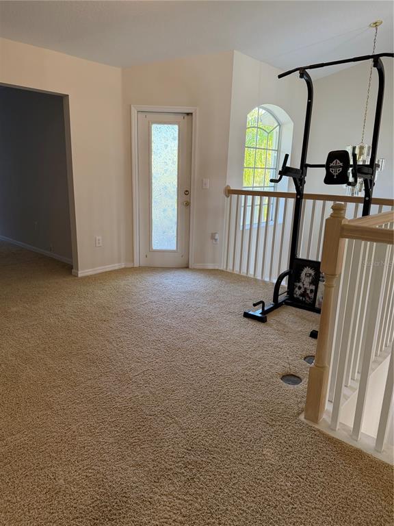 10760 Plantation Bay Drive Tampa, FL 33647 - Photo 32 of 39 an empty room with windows and entryway