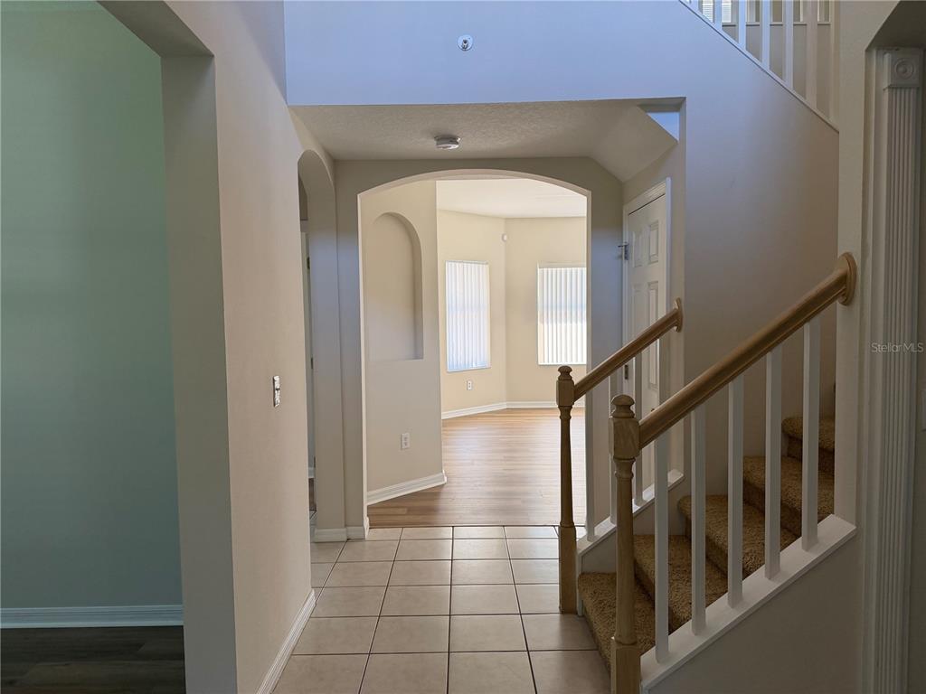 10760 Plantation Bay Drive Tampa, FL 33647 - Photo 5 of 39 a view of a hallway with wooden floor and staircase