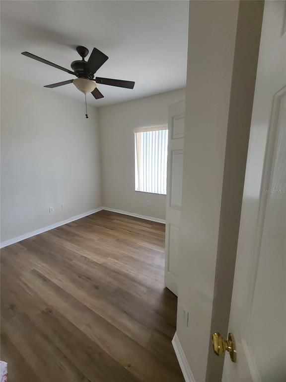 10760 Plantation Bay Drive Tampa, FL 33647 - Photo 10 of 39 an empty room with windows and fan