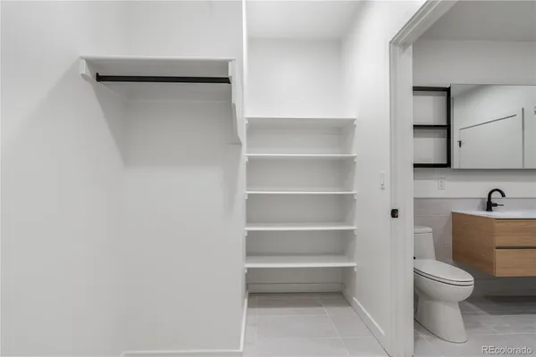 a bathroom with a toilet and a sink