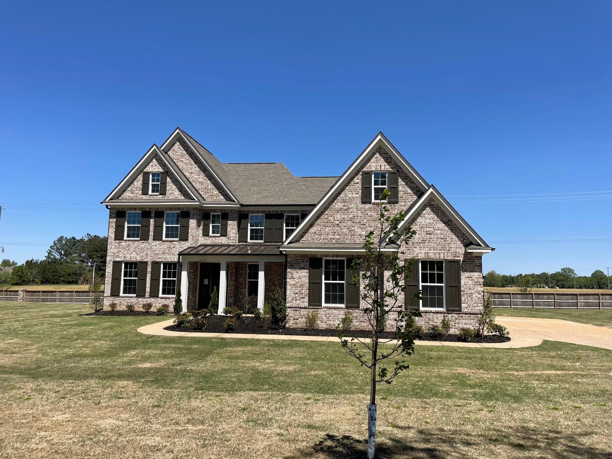 a front view of a house with swimming pool and porch