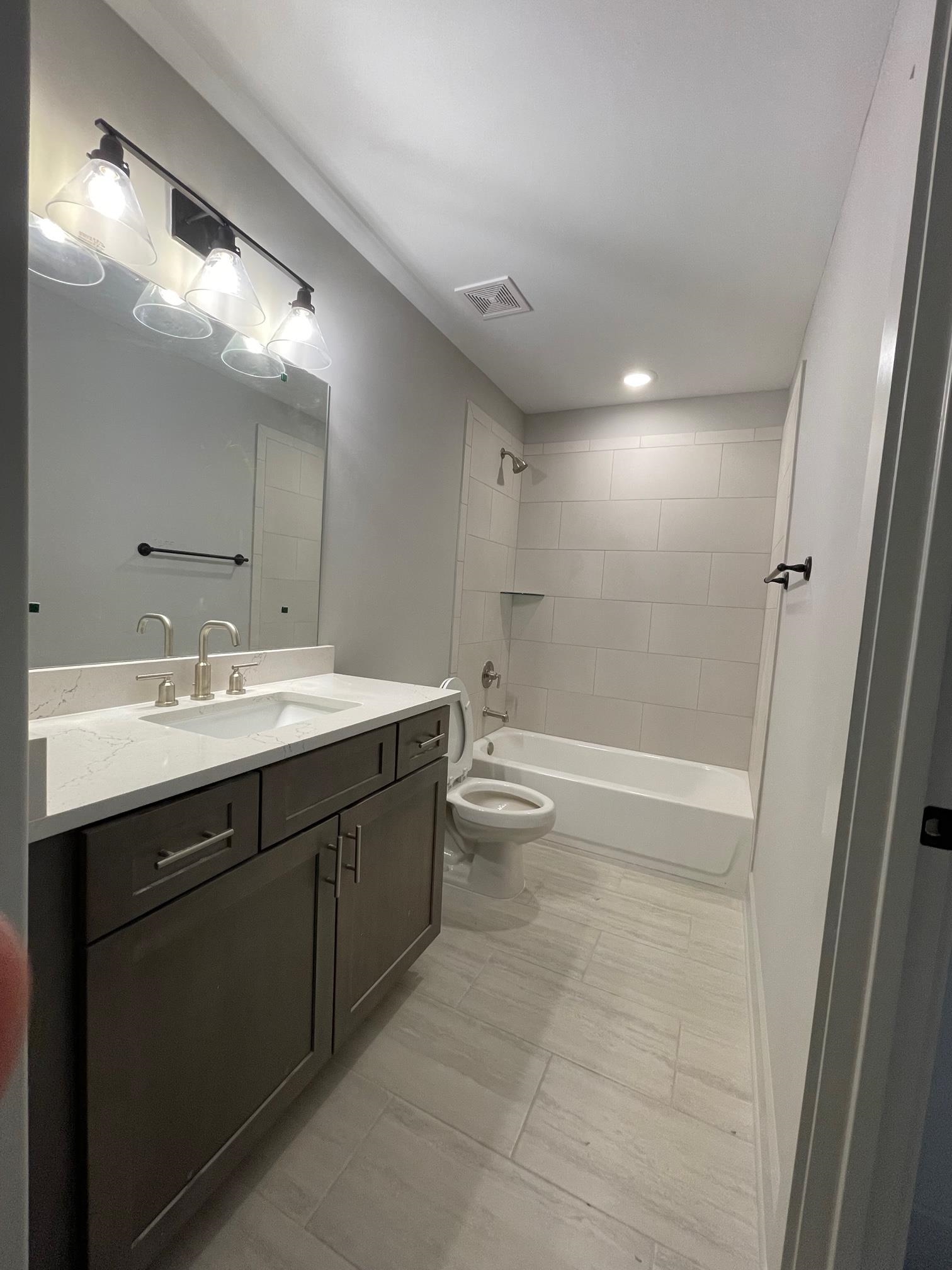 11150 Shelby Post Road Collierville, TN 38017 - Photo 11 of 25 a bathroom with a double vanity sink mirror double and toilet