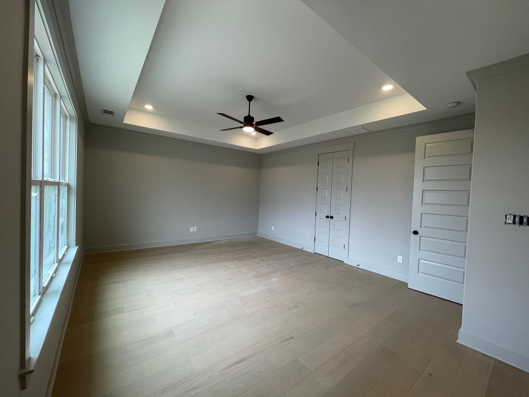 11150 Shelby Post Road Collierville, TN 38017 - Photo 19 of 25 an empty room with a ceiling fan and window