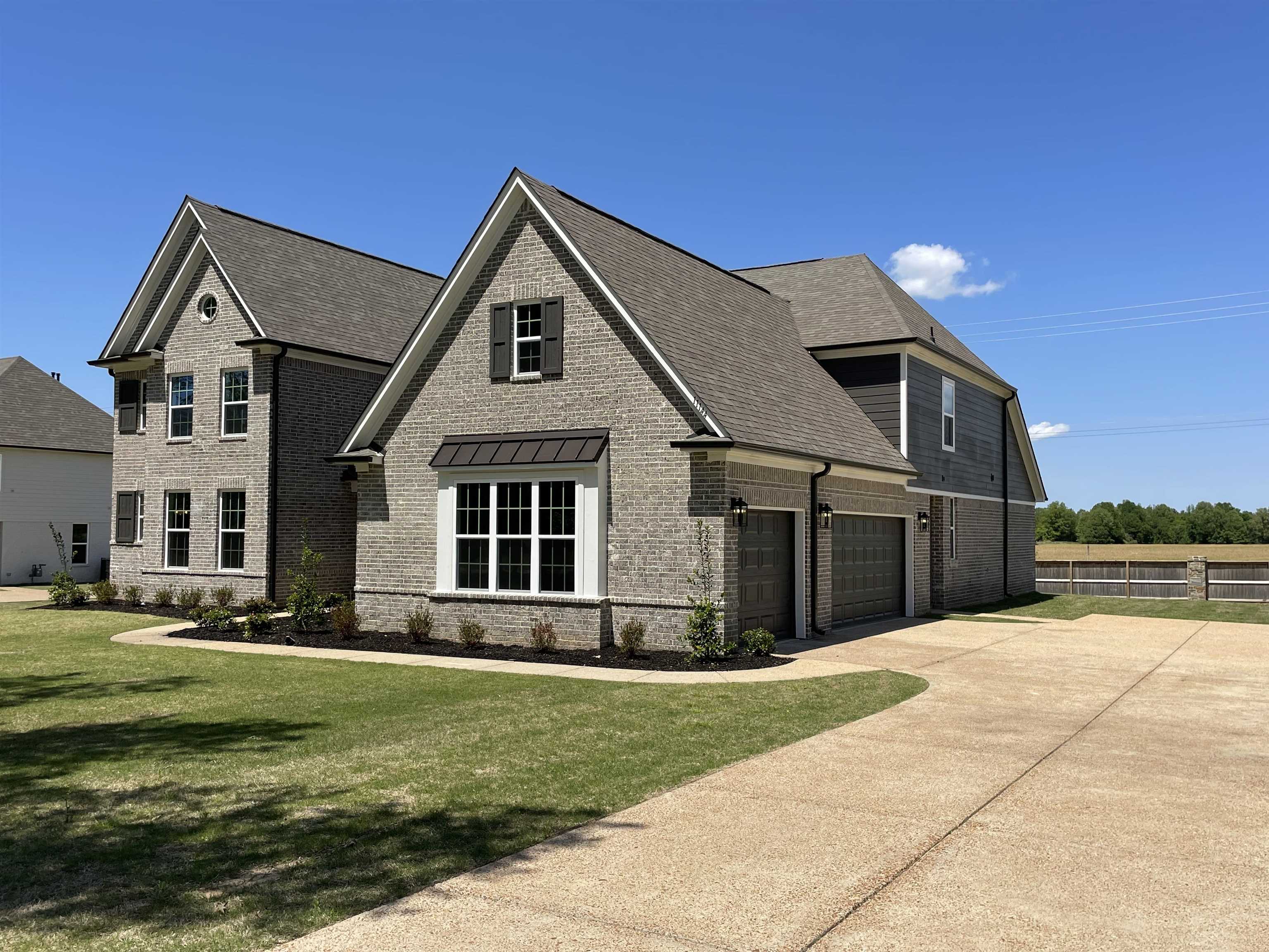 11150 Shelby Post Road Collierville, TN 38017 - Photo 2 of 25 a front view of a house with a yard