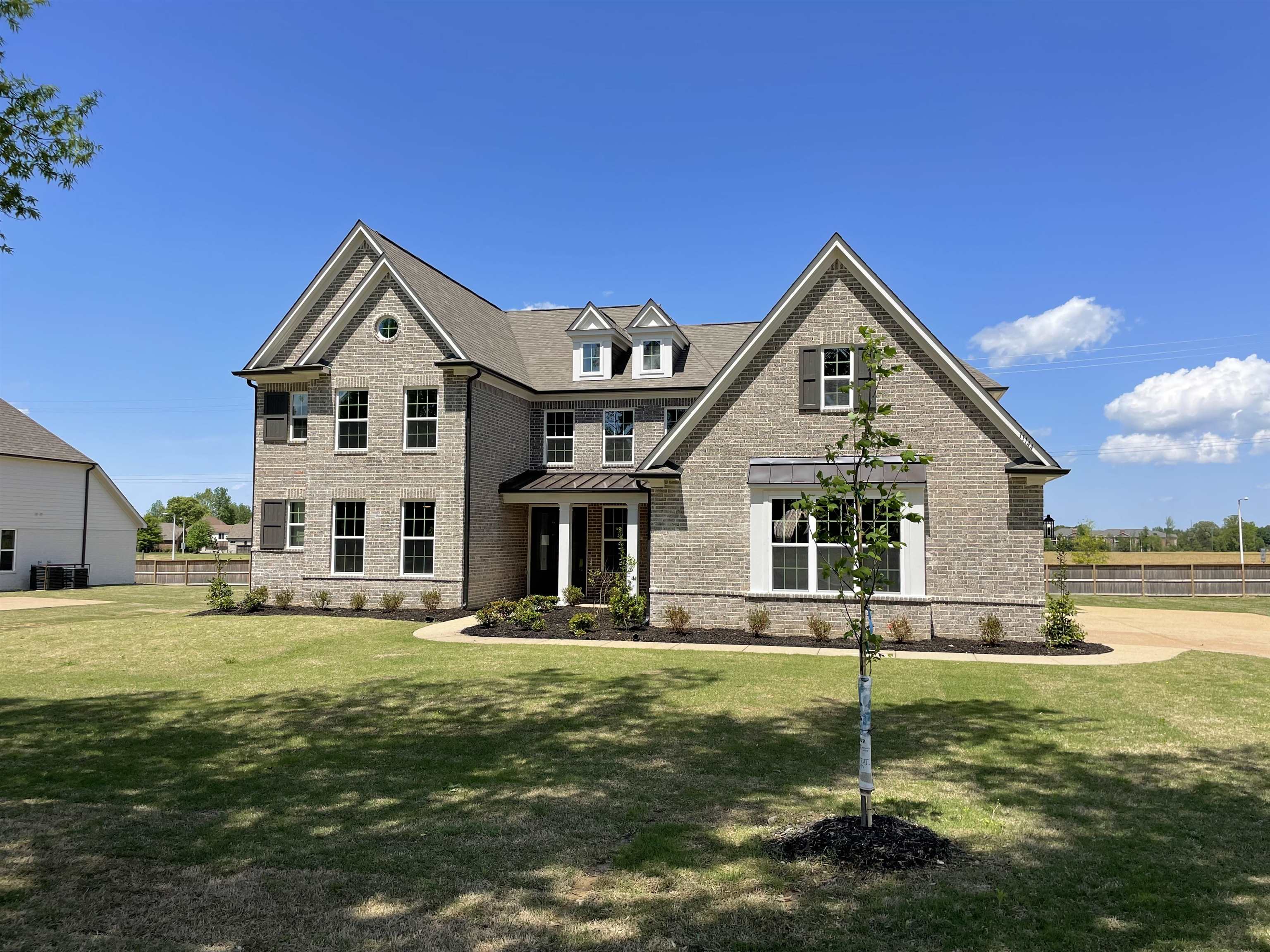 11150 Shelby Post Road Collierville, TN 38017 - Photo 3 of 25 a front view of a house with a yard