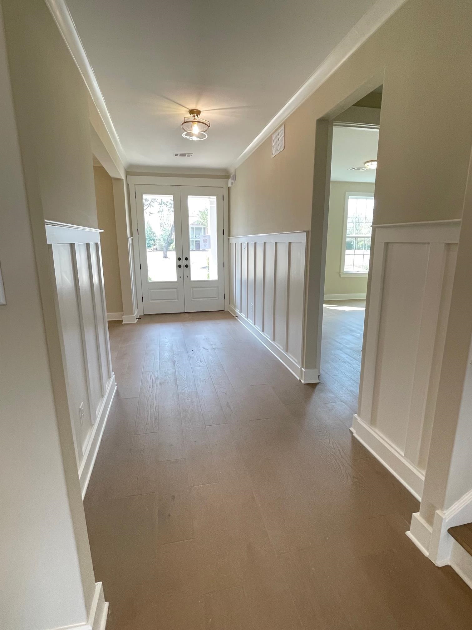 11150 Shelby Post Road Collierville, TN 38017 - Photo 4 of 25 a view of a hallway with windows and stairs