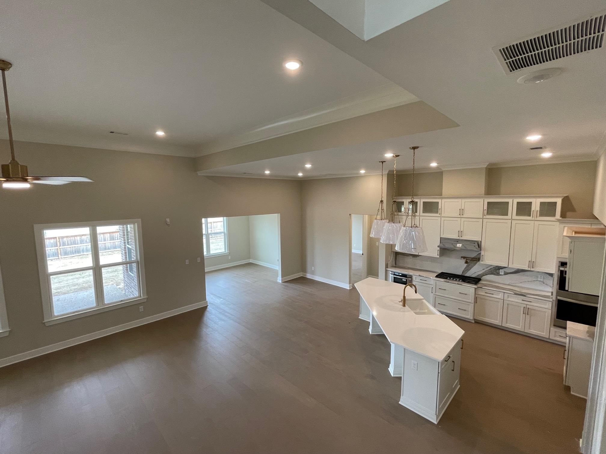 11150 Shelby Post Road Collierville, TN 38017 - Photo 6 of 25 a living room with couches and kitchen view with wooden floor