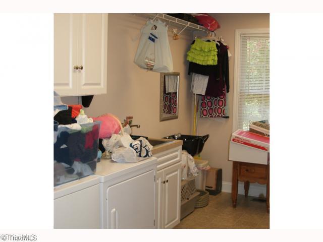 5059 High Point Road Kernersville, NC 27284 - Photo 5 of 8 Other. large laundry with sink and cabinets