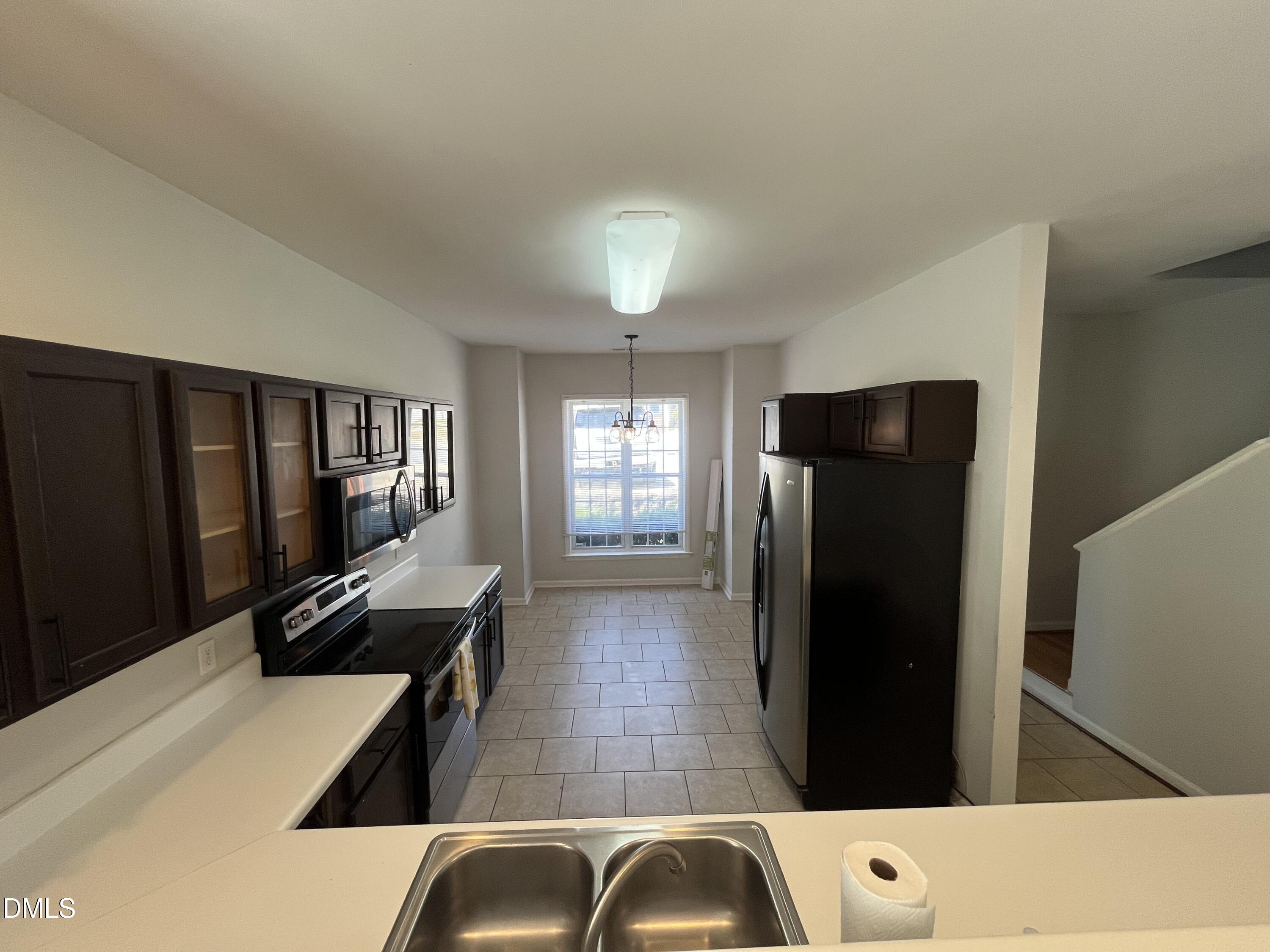 2036 Turtle Point Drive Raleigh, NC 27604 - Photo 5 of 29 a kitchen with a refrigerator and a stove top oven