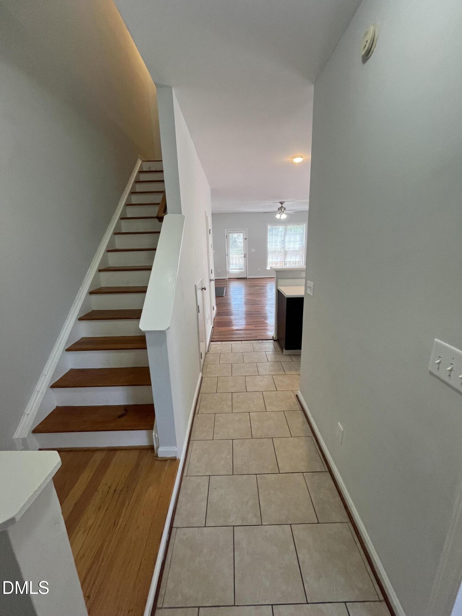 2036 Turtle Point Drive Raleigh, NC 27604 - Photo 6 of 29 a view of a hallway with wooden floor and staircase