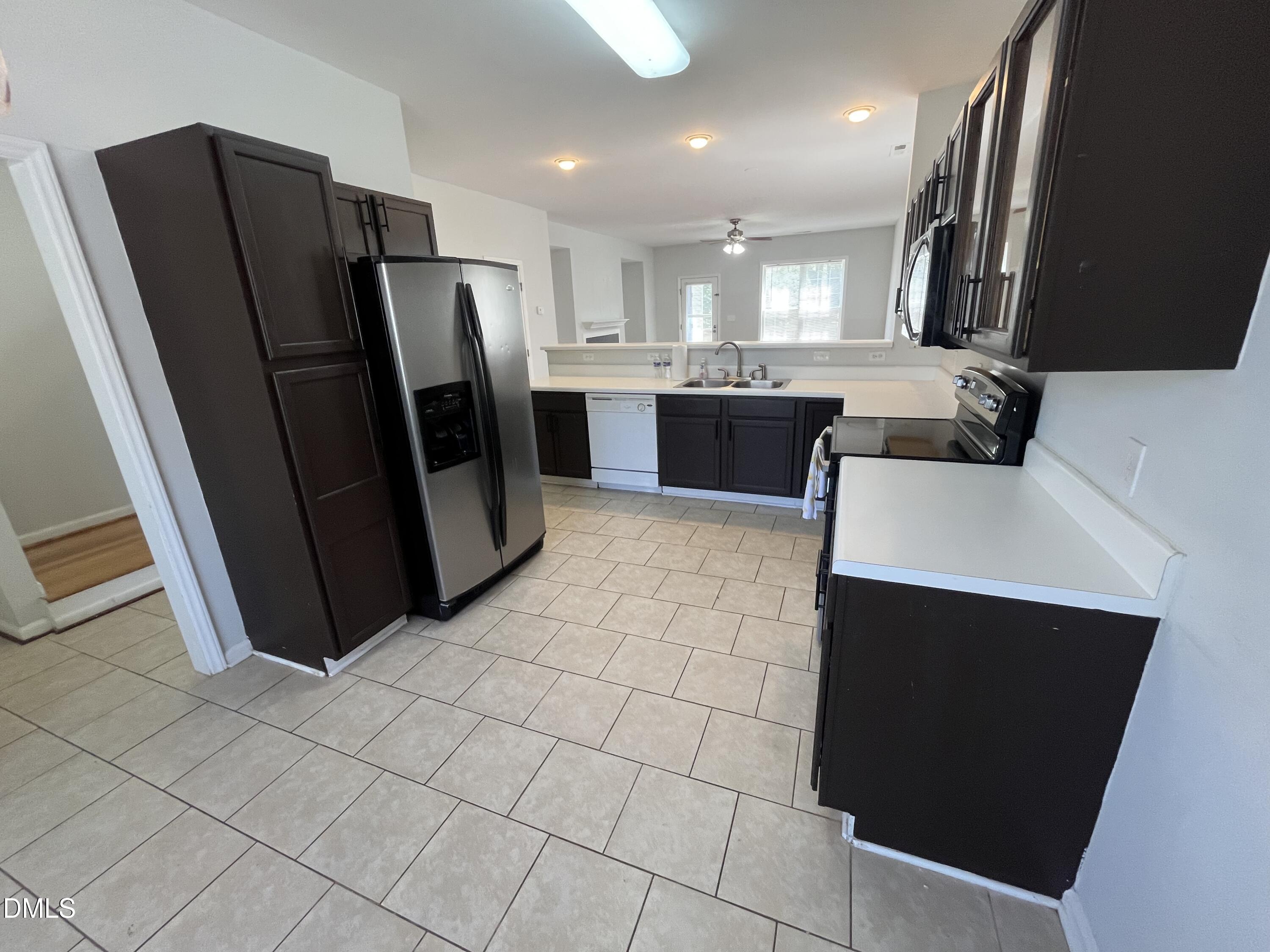 2036 Turtle Point Drive Raleigh, NC 27604 - Photo 7 of 29 a kitchen with stainless steel appliances a refrigerator and a sink