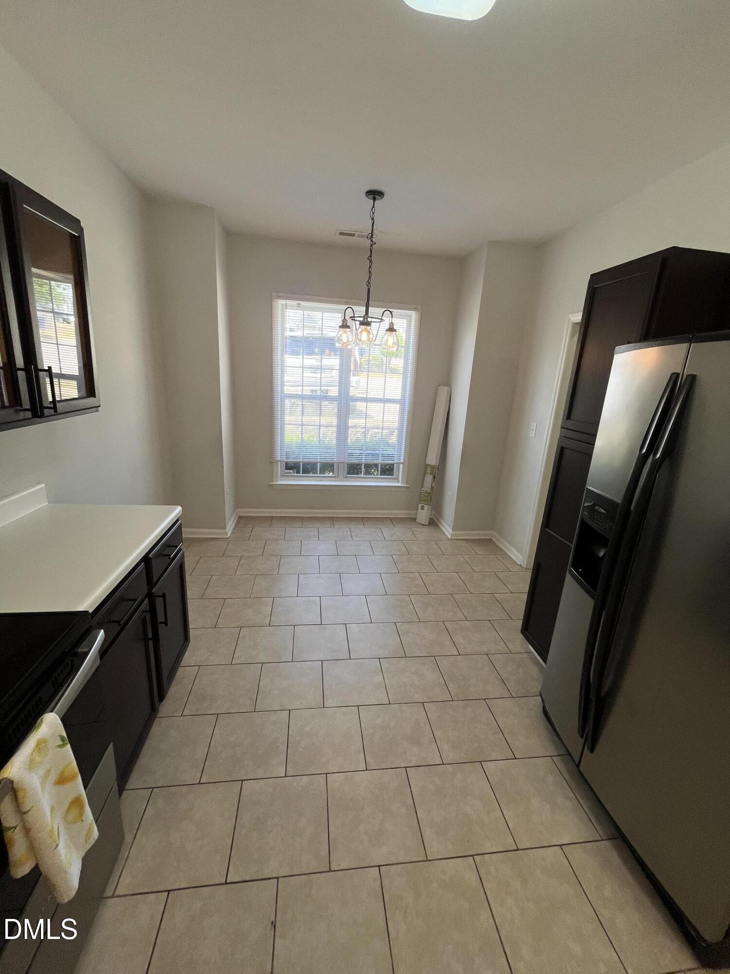 2036 Turtle Point Drive Raleigh, NC 27604 - Photo 8 of 29 a view of a kitchen with a sink cabinet and a window