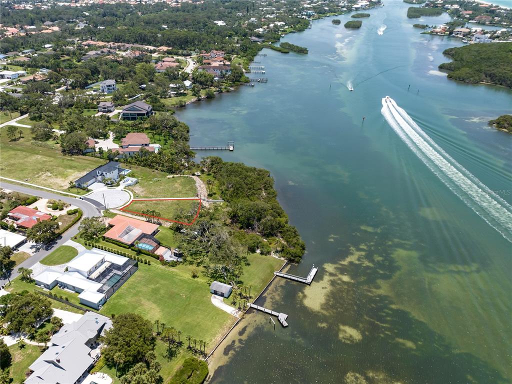 1461 Bayshore Road Nokomis, FL 34275 - Photo 4 of 6 an aerial view of residential houses with outdoor space