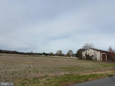 a view of a lake with houses in the background