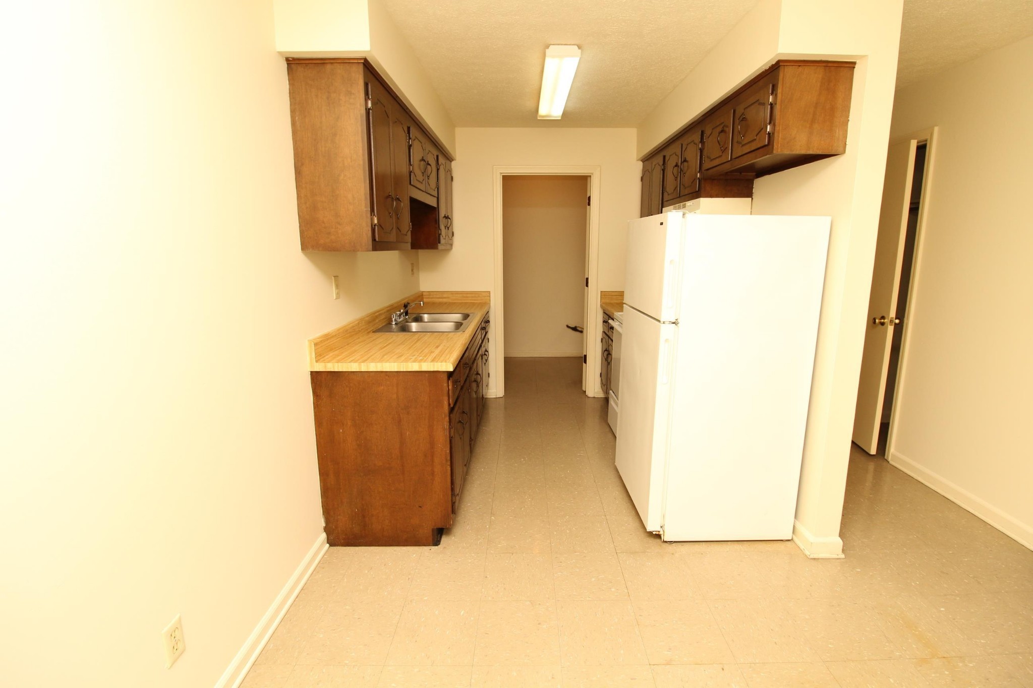2830 Greenville Road, Unit C2 Hopkinsville, KY 42240 - Photo 3 of 10 a room with a sink and a refrigerator