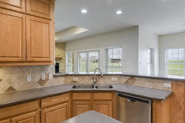a kitchen with a sink and cabinets