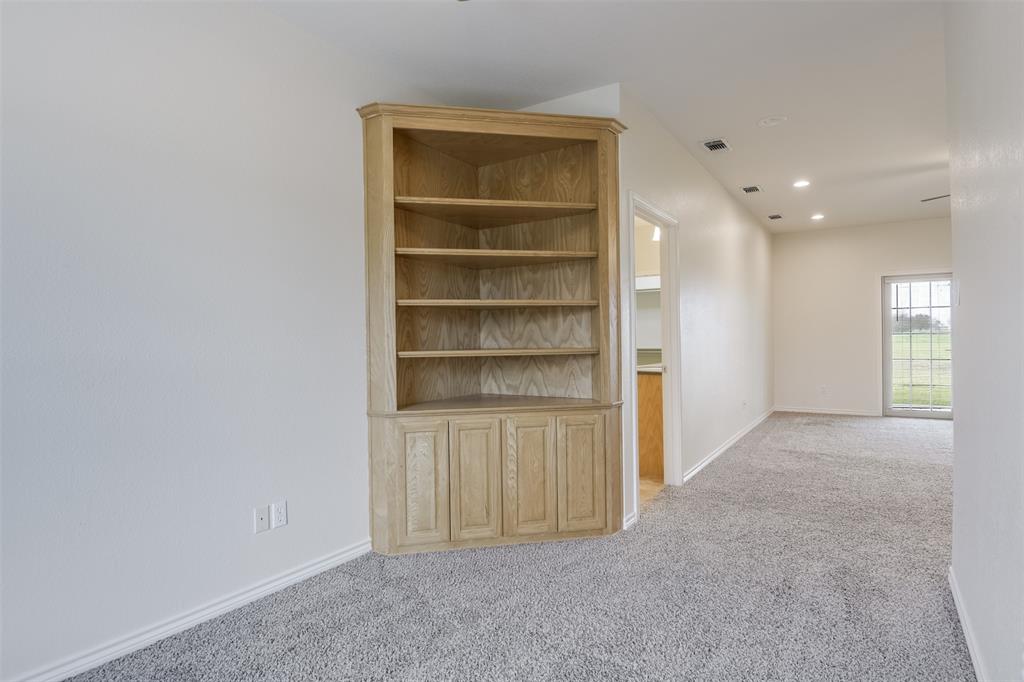 1066 W Road Waxahachie, TX 75165 - Photo 19 of 36 a view of an empty room and a window
