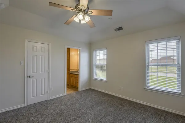 a view of empty room with windows