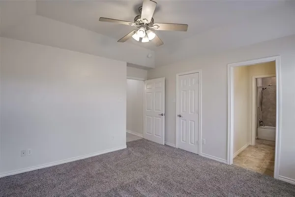 a view of a room with a ceiling fan and a chandelier fan