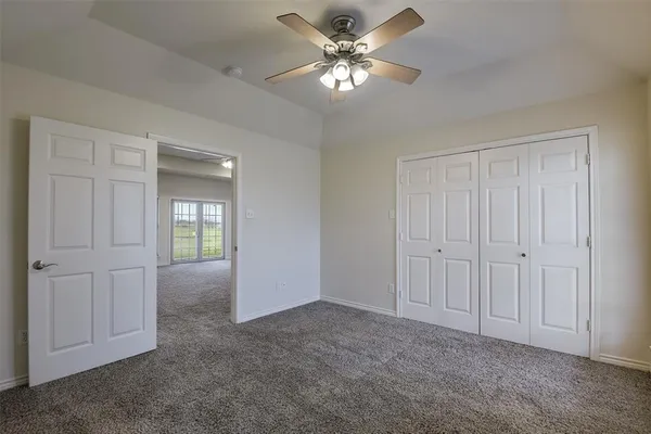 a view of a livingroom with a chandelier fan
