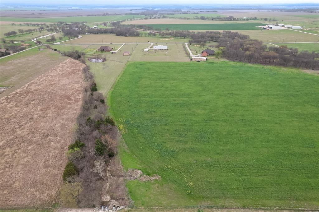 1066 W Road Waxahachie, TX 75165 - Photo 36 of 36 an aerial view of a houses with outdoor space and trees