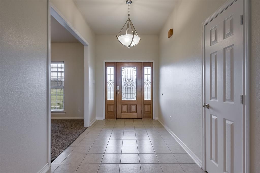 1066 W Road Waxahachie, TX 75165 - Photo 4 of 36 a view of a hallway with windows