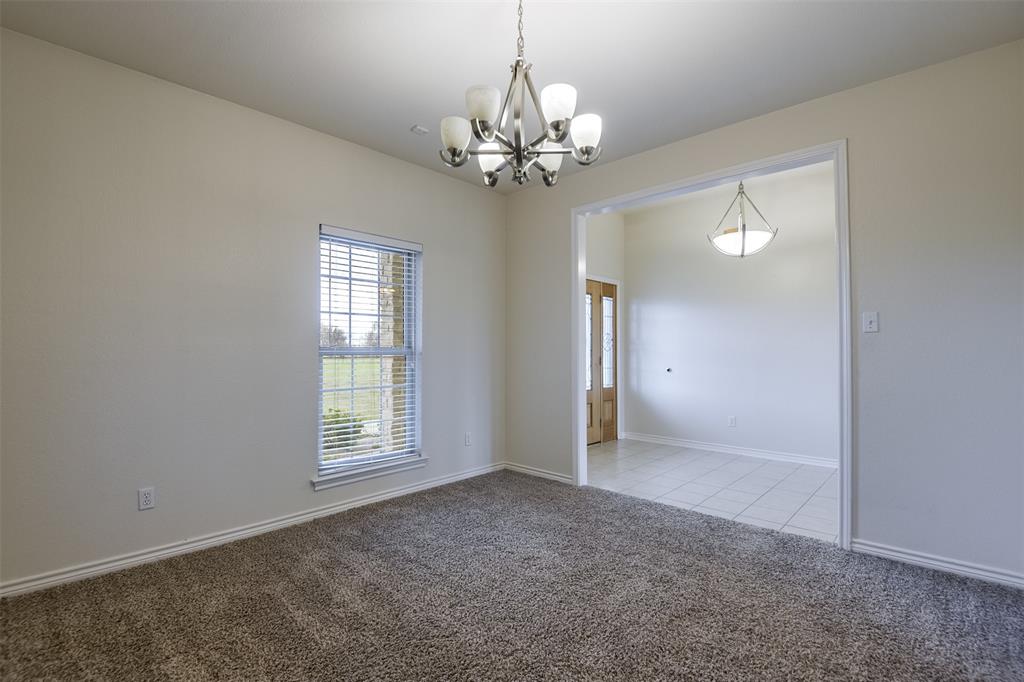 1066 W Road Waxahachie, TX 75165 - Photo 5 of 36 a view of an empty room with a window