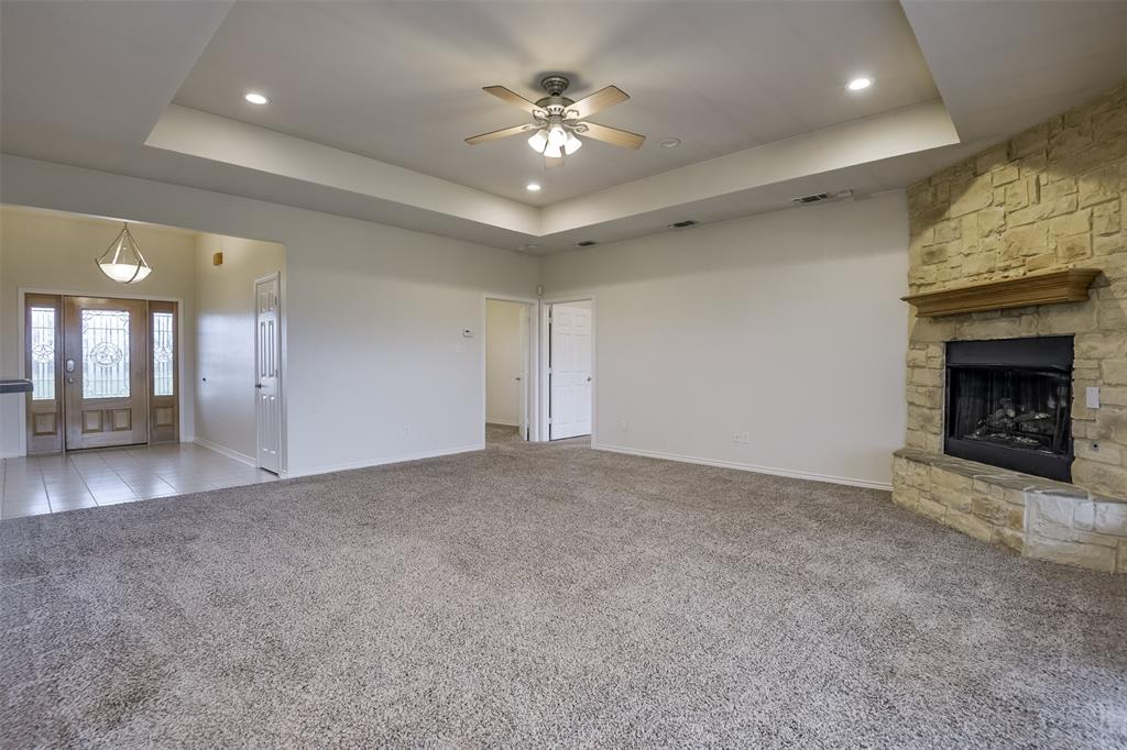 1066 W Road Waxahachie, TX 75165 - Photo 7 of 36 a view of an empty room and chandelier fan