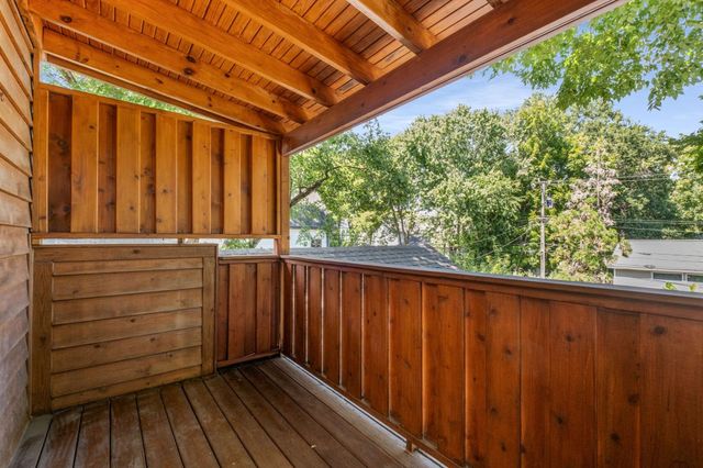 a view of a balcony with wooden floor