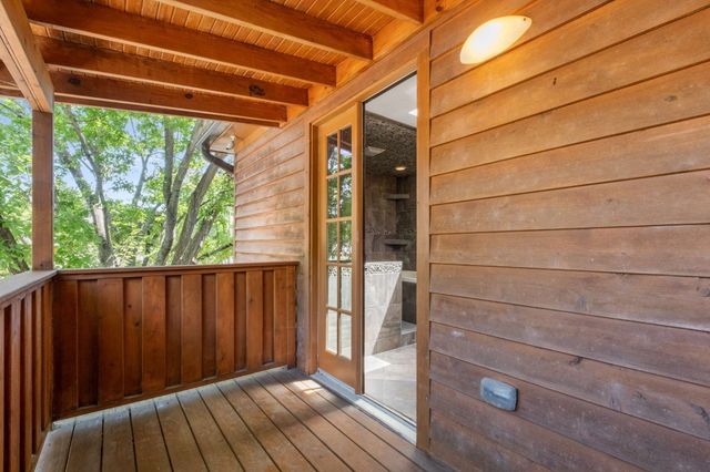 a view of outdoor space with wooden floor