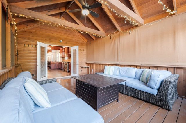 a patio with a table and chairs