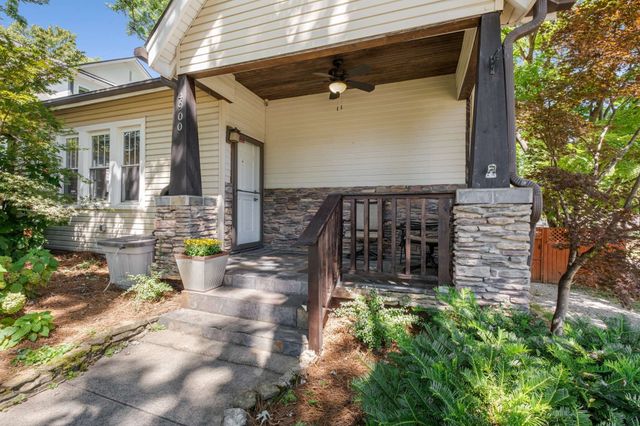 a view of a water fountain in front of a house