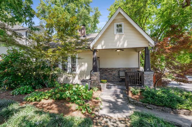 an aerial view of residential houses with city view