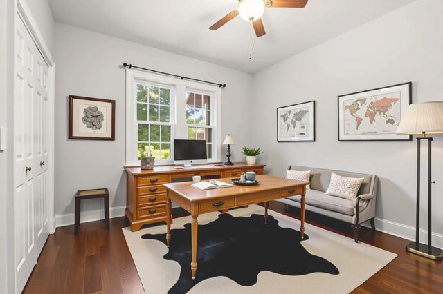 a workspace with furniture and window