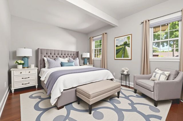 a bedroom with a bed and a couch