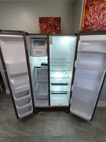 a bathroom with a toilet a sink and shower