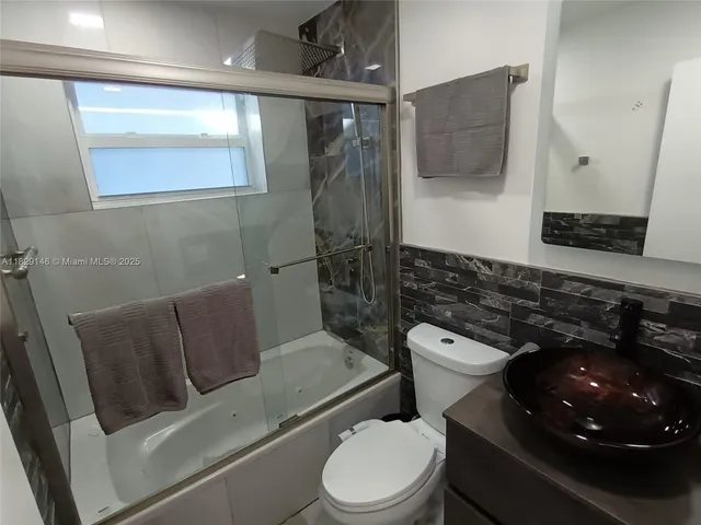 a bedroom with furniture and wooden floor