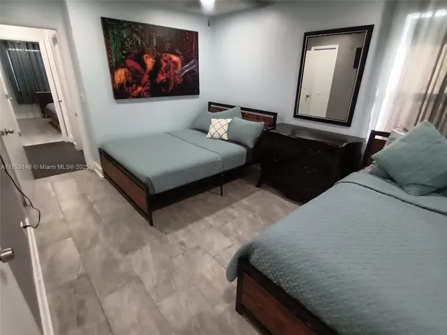 a room with a bed and a table in it