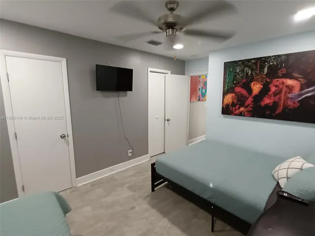 a room with a dresser and a mirror