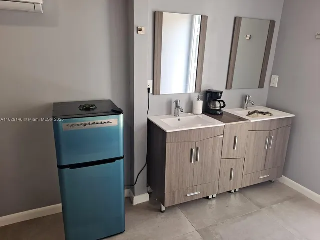 a bed room with a bed and a mirror