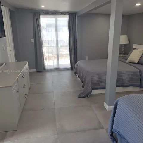 a kitchen with a sink a refrigerator and a stove