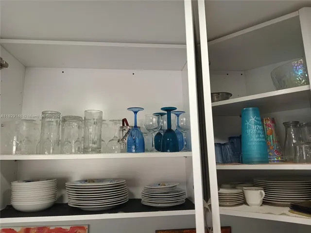 a bedroom with a large bed and a flat screen tv