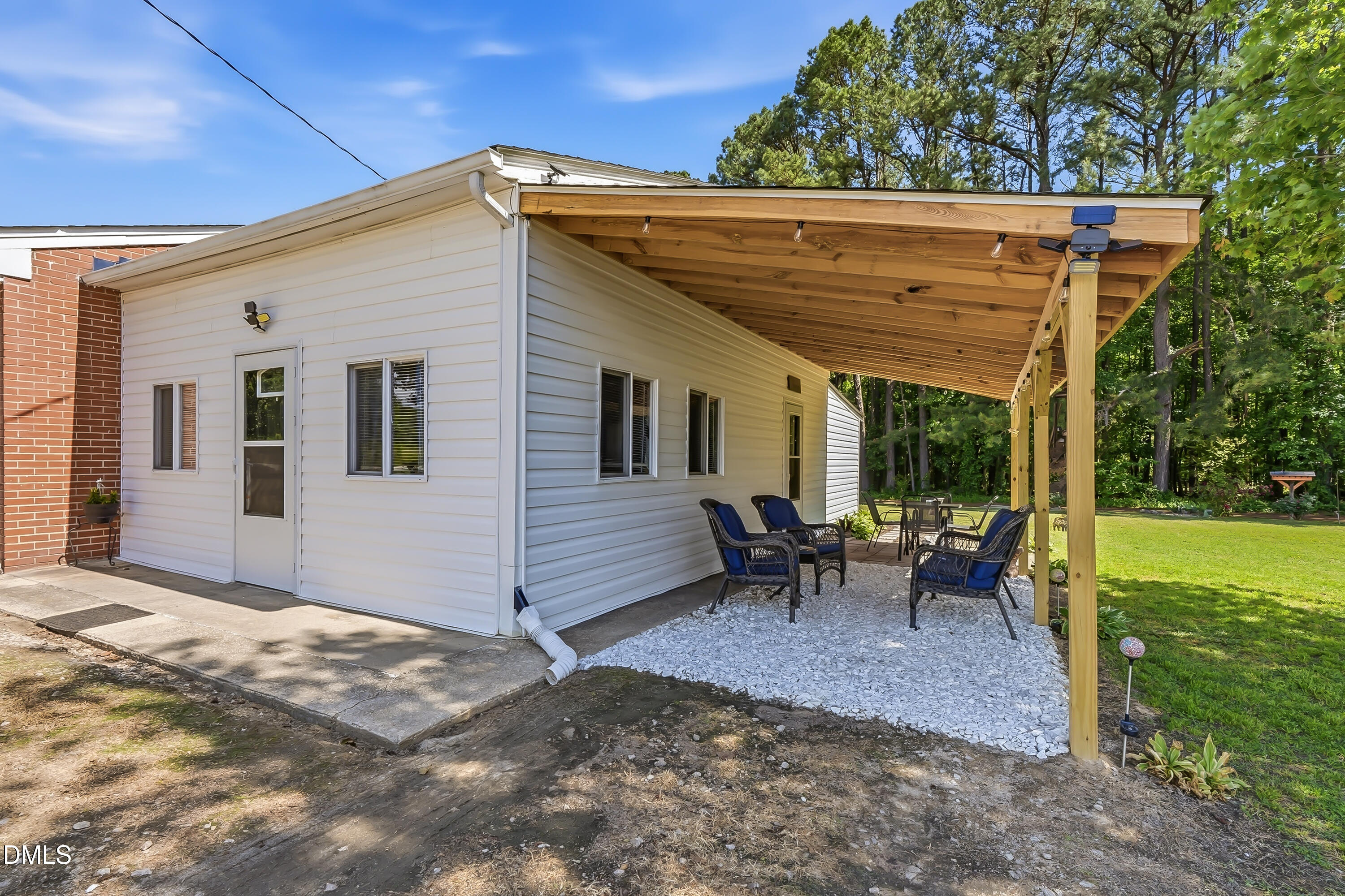 4967 Highway 581 Spring Hope, NC 27882 - Photo 7 of 44 a view of a house with backyard and sitting area