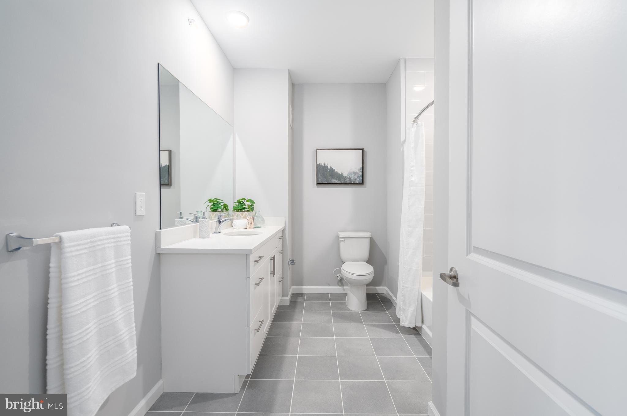 700 Citation Lane, Unit 1011 Cherry Hill, NJ 08002 - Photo 27 of 33 a bathroom with a sink toilet and shower