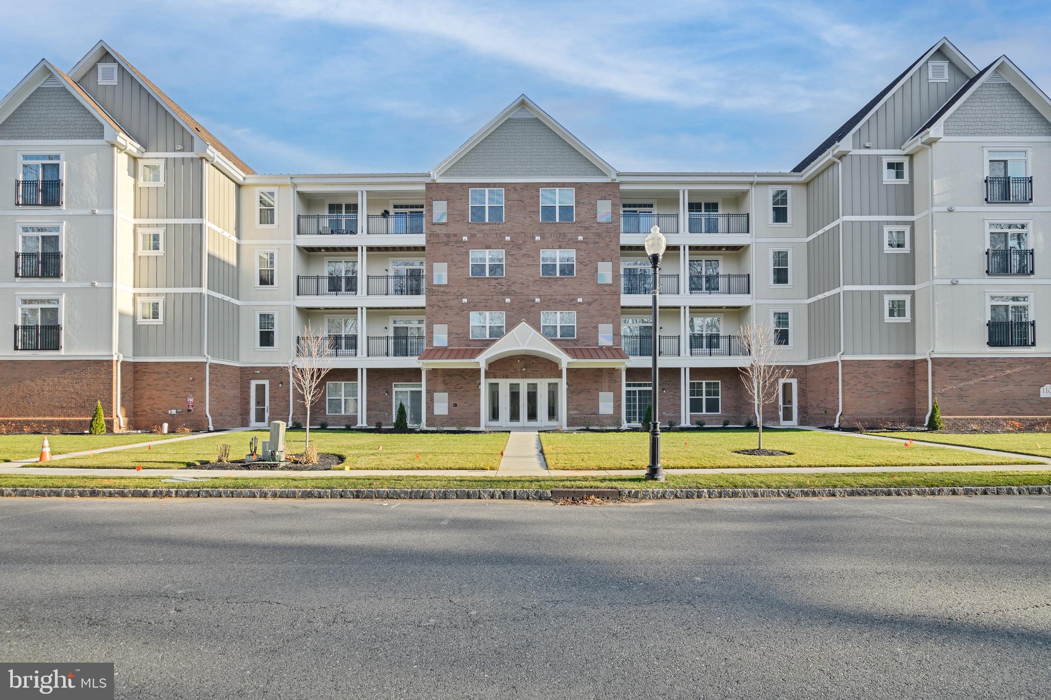 700 Citation Lane, Unit 1011 Cherry Hill, NJ 08002 - Photo 7 of 33 a front view of building with street