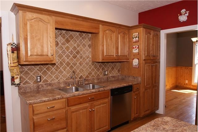 83 Rutledge Falls Road Tullahoma, TN 37388 - Photo 11 of 25 a kitchen with stainless steel appliances granite countertop a sink and cabinets
