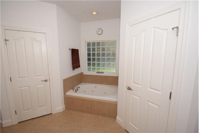 83 Rutledge Falls Road Tullahoma, TN 37388 - Photo 15 of 25 a bathroom with a tub and a shower